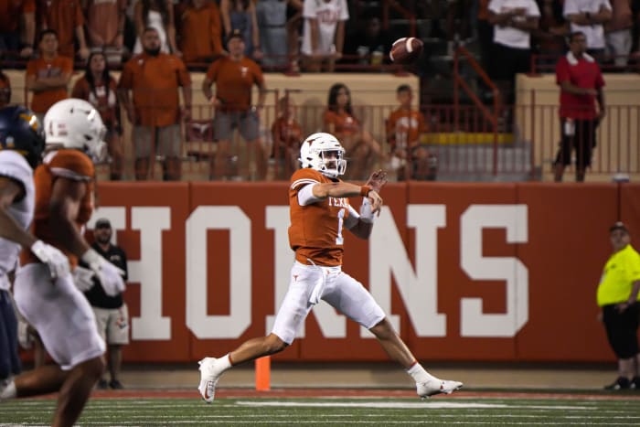 Texas quarterback Hudson Card (1) throws a pass during the game against West Virginia at Royal Memorial Stadium in Austin, Texas